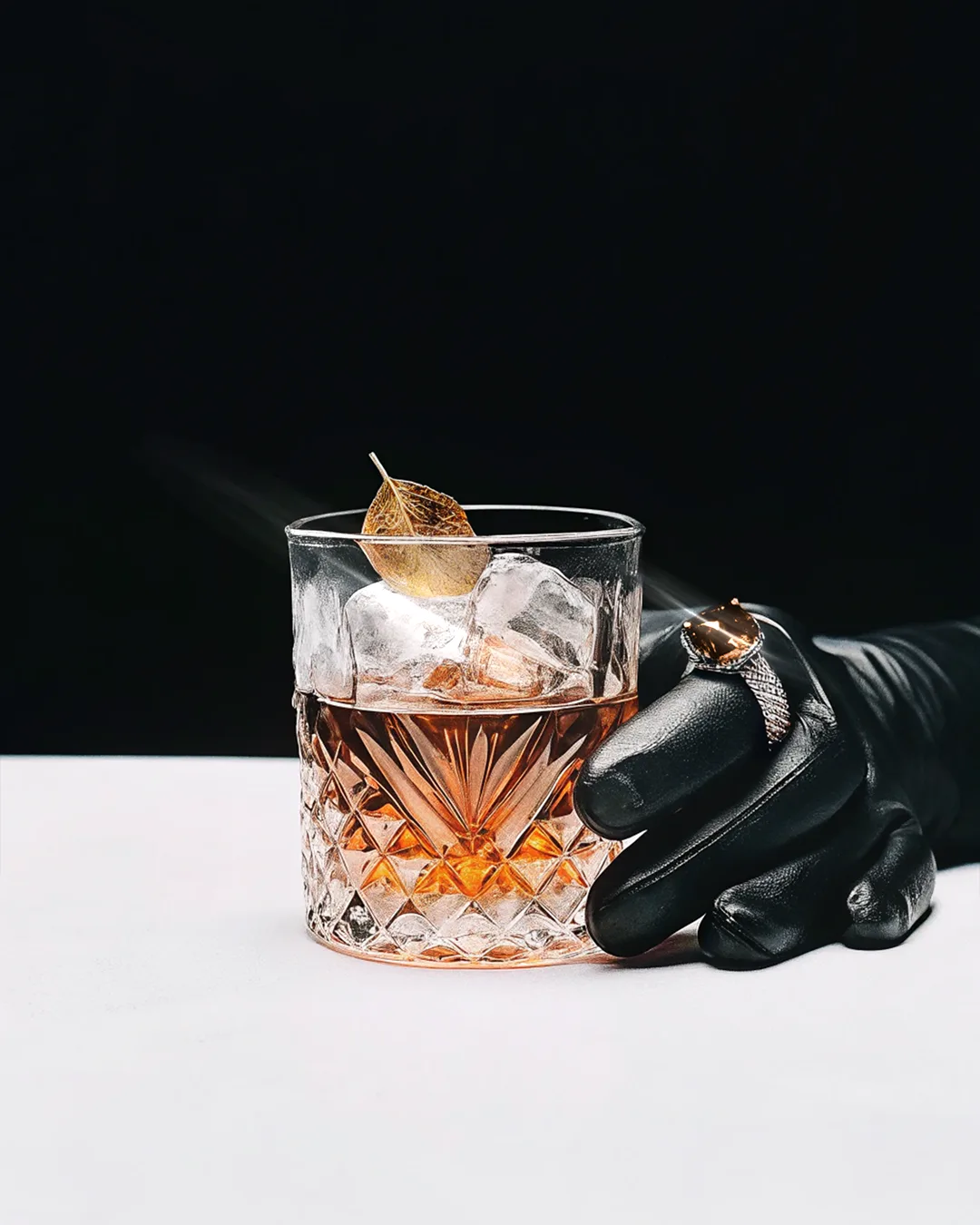 male model, leather gloves, cognac on the rock, amber jewels